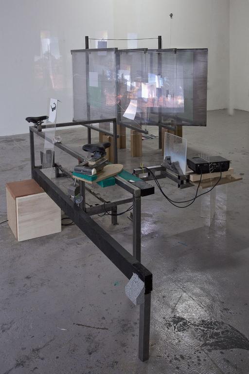 Neïl Beloufa "Nice seats and projection" People?s passion, lifestyle, beautiful wine, gigantic glass tower, all surrounded by water 2013 (video: 2011) video installazione / video installation video: 10’ loop HD