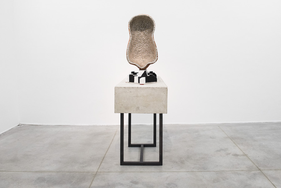 Benedikt Hipp,  Console with pin-body mounted on repetition,   (pneumopathologic studies),   2015 Concrete,   iron,   loam,   bullen-nails,   epoxy,   color approx. 80 x 50x 170 cm  Photo credit: Massimo Valicchia Courtesy: the artist and Monitor,   Rome-New York