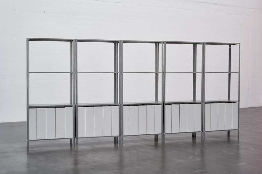 Manor Grunewald, untitled, 2016, aluminum shelves, cardboard boxes, printed panels, 140 x 300 x 27 cm,  photo Ben Hermanni, courtesy Berthold Pott Gallery Cologne